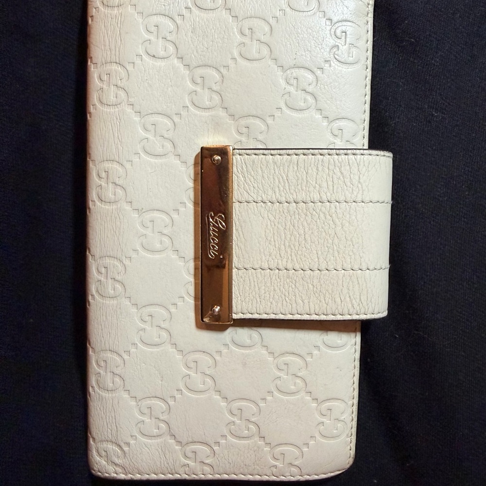 GUCCI
Ivory Guccissima Leather Long Continental Flap Wallet